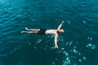 © Kike Arnaiz/ADDICTIVE STOCK - Man floating in blue water