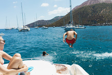 Man Jumping From Yacht