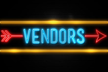 Vendors  - Fluorescent Neon Sign On Brickwall Front View