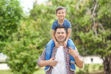 Happy father and son in park