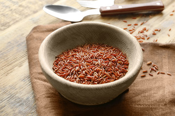 Canvas Print - Bowl with jasmine brown rice on table