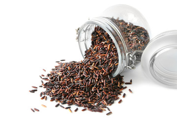 Canvas Print - Brown rice and glass jar on white background