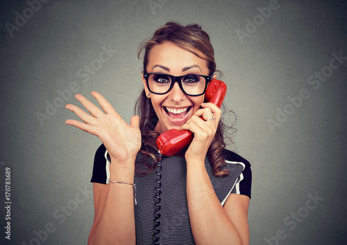 Fotografie, Obraz Happy young woman receiving good news winning on the phone