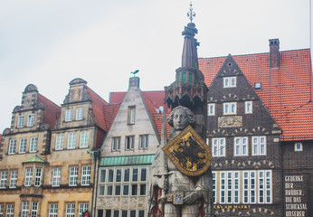 View of Bremen market square with Town Hall, Roland statue and crowd of people, historical center, Germany