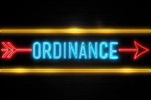 Ordinance  - Fluorescent Neon Sign On Brickwall Front View