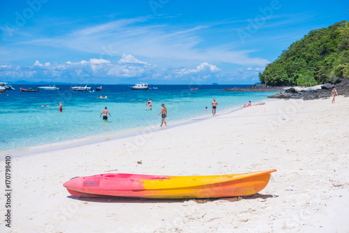 Tourists Relaxing On The Beach Of The Banana Beach Coral