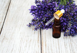 Fototapeta Lawenda - lavender oil with fresh lavender