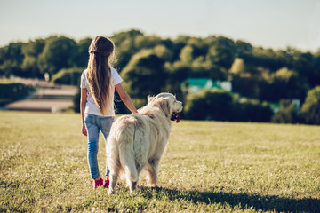 Wall Mural - Little cute girl with dog