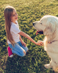 Wall Mural - Little cute girl with dog