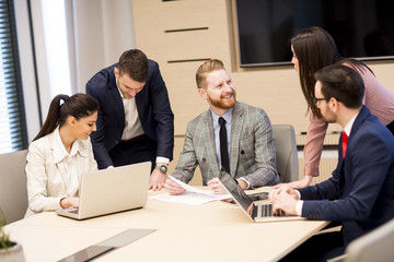 Wall Mural - Young business people working together in office