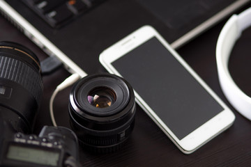 DSLR camera and a mobile phone with built-in camera, for creating and editing photos