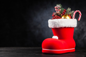 Wall Mural - Santa's shoe on dark background