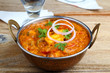 © rakeshpicholiya - Indian Food or Indian Curry in a copper brass serving bowl.
