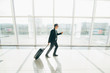 © F8  \ Suport Ukraine - Business man at international airport runing to terminal gate for airplane travel trip