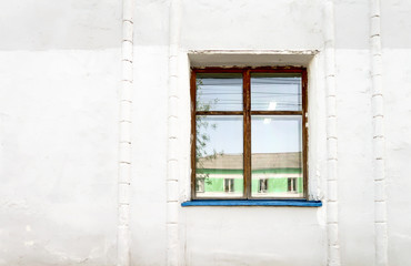 Wooden window, white old wall