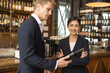 © Jestercine - Woman present wine for Businessman at Bar with attractive smiling. People with Business concept.