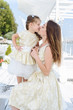 © romanets_v - Happy loving family. mother with her daughter in a white light dress