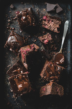 Chocolate Cherry Brownies Decorated With Melted Chocolate On Dark Background. Table Top View