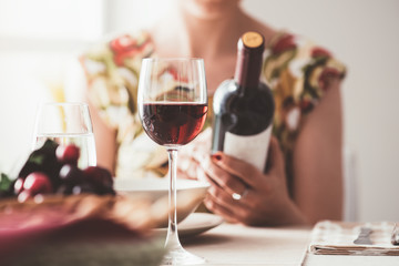 Woman reading a wine label