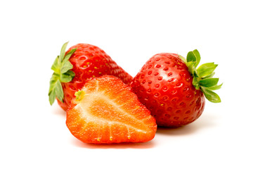 Wall Mural - Ripe strawberry on white, closeup.