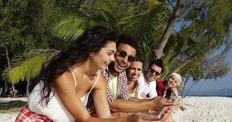 Sticker - People Group Communication Using Cell Smart Phones Chatting Online Talking, Sit Outdoors Under Palm Trees Slow Motion 60