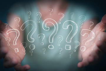 Poster - Businesswoman touching and holding hand drawn question marks
