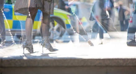 Poster - Walking people in the City of London. Multiple exposure image, modern life concept.