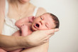 © Alesia Zhuk - newborn baby mom hands on