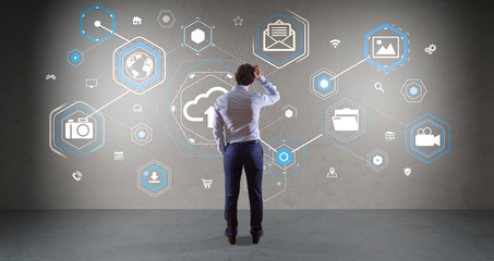 Poster - Businessman using cloud interface on a wall 3D rendering