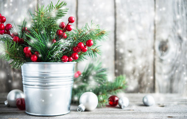 Wall Mural - christmas composition with spruce, red berries and white, silver, red xmas ornaments on rustic wood 