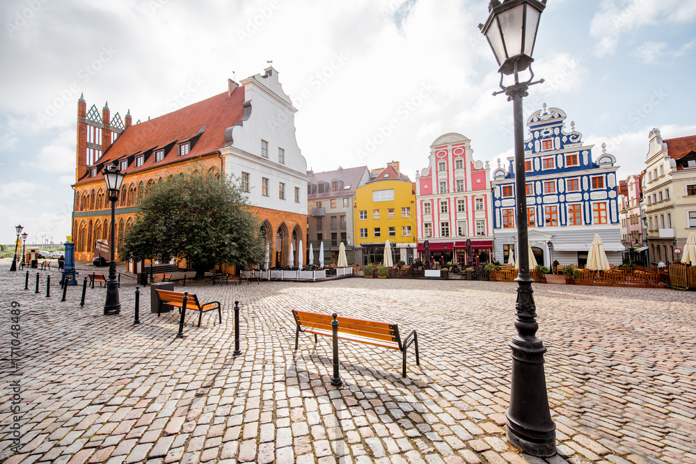 View on the Market square with beautiful colorful buildings during the morning light in Szczecin city, Poland - obrazy, fototapety, plakaty 