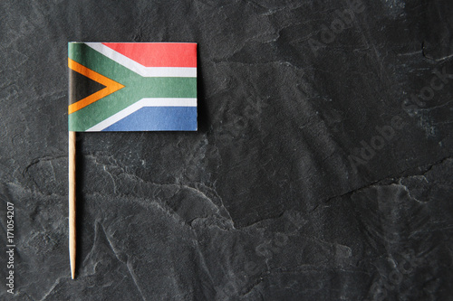 Fotografie, Obraz A South African flag toothpick on a black slate background.