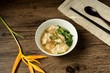 Shrimp wonton with braised pork in soup on wooden table - Asian food style  / Select focus image