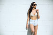 © elnariz - Fun lifestyle of skinny thin fashionable trendy young woman in california type sunshine