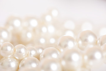 Pile of pearls on the white background