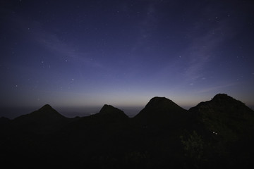 Wall Mural - The Beautiful night sky with the starry light at Doi Luang Chiang Dao in Chiang Mai province in Thailand.