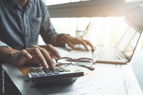 Cuadros en Lienzo close up, business man or lawyer accountant working on accounts using a calculat