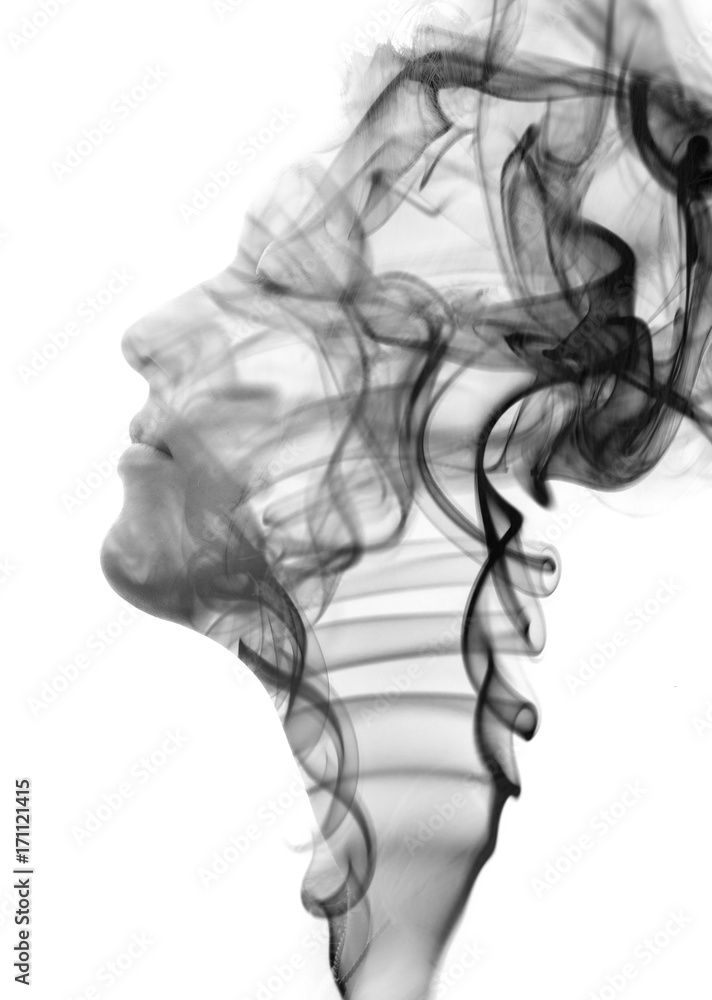 Double exposure portrait of a sensual model dissolving into a rising ...