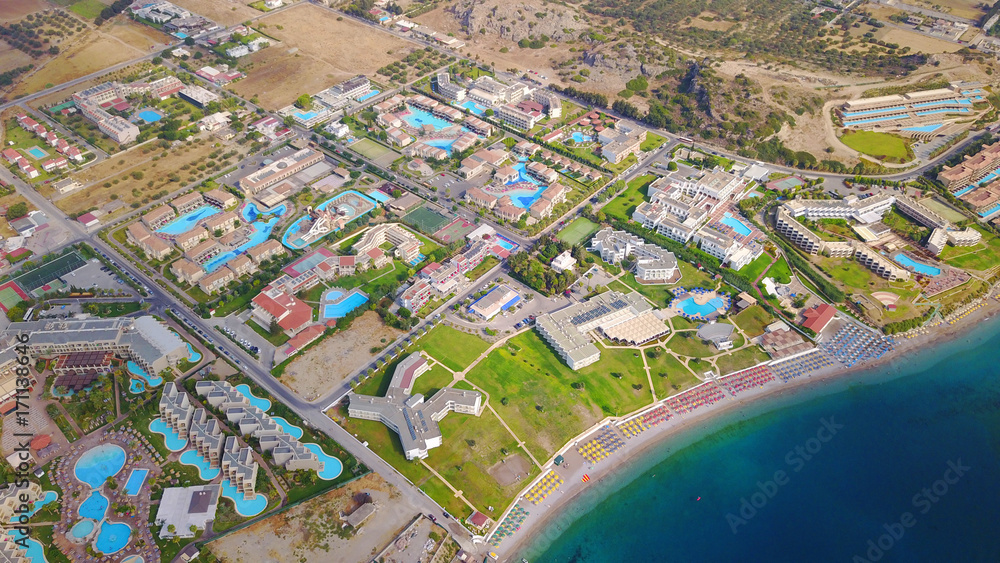 August 2017: Aerial drone photo of famous pools and 5 star resorts - hotels at small village of Kolympia bay, Rhodes island, Aegean, Dodecanese, Greece - obrazy, fototapety, plakaty 