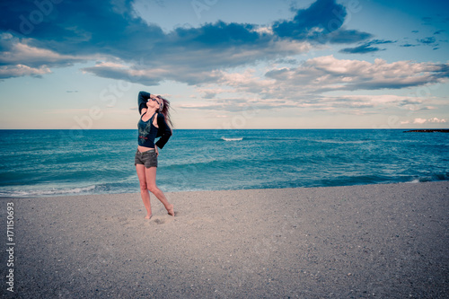 Femme Sur La Plage Au Coucher Du Soleil Buy This Stock