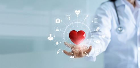 Wall Mural - Medicine doctor holding red heart shape iwith medical icon network connection modern virtual screen interface, service mind and medical technology network concept