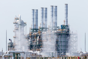 Refinery tower in petrochemical industrial plant with blue sky