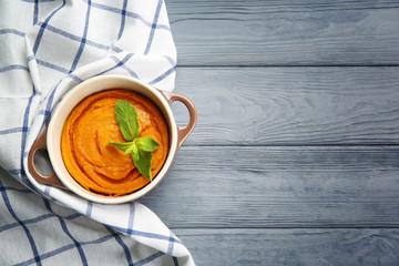 Canvas Print - Casserole with tasty carrot souffle on wooden table