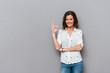 © Drobot Dean - Happy woman showing ok sign and looking at the camera