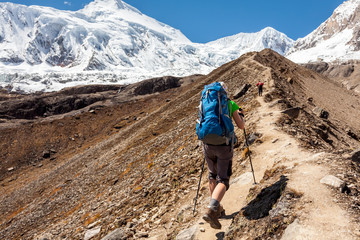 Wall Mural - hiker is climbig to manaslu base camp in highlands of himalayas on manaslu circuit