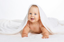 Cute Smiling Baby Under Towel After Bath