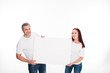 © LIGHTFIELD STUDIOS - couple holding empty card