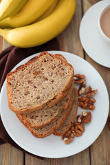 Wall Mural - Sliced banana bread with nuts on plate