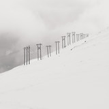 Fototapeta Sypialnia - Snow electric poles
