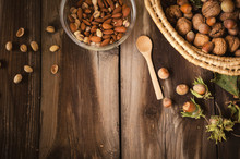 Healthy Snack On Rustic Table Indoors On Autumn. Almonds And Pistachio In Bowl.